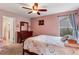 Cozy bedroom featuring a dresser and a comfortable bed, decorated with charm at 10614 Kicking Horse Dr, Littleton, CO 80125