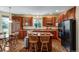 Modern kitchen featuring stainless steel appliances, granite counters, and an island with seating for casual dining at 10614 Kicking Horse Dr, Littleton, CO 80125