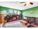 Vibrant living room with built-in bookcase and comfortable seating, great natural lighting at 10614 Kicking Horse Dr, Littleton, CO 80125