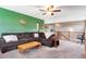Cozy living room featuring a green accent wall and an upper-level view at 10614 Kicking Horse Dr, Littleton, CO 80125