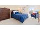 Inviting bedroom features a comfortable bed, and ample natural light from the window and a dresser at 130 N Pearl St # 304, Denver, CO 80203
