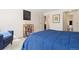 A cozy bedroom featuring neutral carpet and paint, artwork, closet, and access to an ensuite bathroom at 130 N Pearl St # 304, Denver, CO 80203