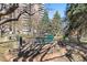 Outdoor area with benches, landscaping, stone fire pit and building in the background at 130 N Pearl St # 304, Denver, CO 80203