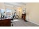 Home office features a desk, comfortable chair, shelving and large window allowing natural light at 130 N Pearl St # 304, Denver, CO 80203