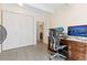 Bright home office features modern desk, comfortable chair, large closet, and hardwood floors at 130 N Pearl St # 304, Denver, CO 80203