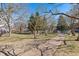 A neighborhood park features a walking path, mature trees, benches, and picnic tables at 130 N Pearl St # 304, Denver, CO 80203