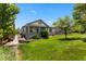 Charming home with a well-manicured lawn, covered porch, and inviting curb appeal at 23421 E Long Pl, Aurora, CO 80016