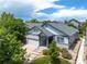 Beautiful aerial view of a single Gathering home with a well-manicured front yard, landscaping, and a two-car garage at 23421 E Long Pl, Aurora, CO 80016