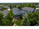 Charming home with a welcoming front porch surrounded by mature trees and a well-kept lawn at 23421 E Long Pl, Aurora, CO 80016
