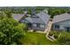 Well-maintained home with lush lawn, mature trees, and stone accents, presenting curb appeal at 23421 E Long Pl, Aurora, CO 80016