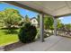 Inviting covered front porch with columns, landscaped yard, and views of the neighborhood at 23421 E Long Pl, Aurora, CO 80016