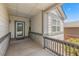 Inviting front porch features stone accents and ample space for outdoor relaxation and greeting guests at 23421 E Long Pl, Aurora, CO 80016