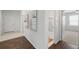 Hallway with hardwood floors and access to bathroom and bedroom at 23421 E Long Pl, Aurora, CO 80016