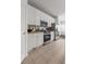 Well-lit kitchen with white cabinets, stainless steel appliances, and tile flooring at 23421 E Long Pl, Aurora, CO 80016