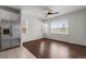 Bright kitchen featuring stainless steel appliances, tile floor, and a view of the outdoors at 23421 E Long Pl, Aurora, CO 80016