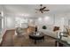 Bright and airy living room featuring hardwood floors, stylish decor, and a comfortable seating area at 23421 E Long Pl, Aurora, CO 80016