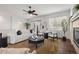 Bright and modern living room with a comfortable sofa, stylish decor, and a cozy fireplace at 23421 E Long Pl, Aurora, CO 80016