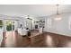Bright and airy living room features a fireplace, hardwood floors, and plenty of natural light, perfect for entertaining at 23421 E Long Pl, Aurora, CO 80016