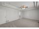 Large main bedroom featuring tray ceiling and archway to bathroom at 23421 E Long Pl, Aurora, CO 80016