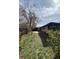 A spacious backyard featuring a patio, lawn, and wooden fence, perfect for outdoor activities at 5600 Dover St, Arvada, CO 80002