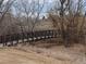 Idyllic community walking bridge over creek surrounded by foliage at 1078 Oak Cir, Denver, CO 80215