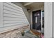 Inviting front door with decorative welcome mat and well-maintained exterior at 1078 Oak Cir, Denver, CO 80215