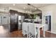 Modern kitchen with stainless steel appliances and a stylish island at 1078 Oak Cir, Denver, CO 80215