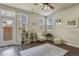 Bright living room with natural light, wood floors, modern decor, and a door leading to the patio at 1078 Oak Cir, Denver, CO 80215