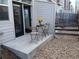 Patio with bistro set, steps to backyard at 1078 Oak Cir, Denver, CO 80215