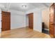 Spacious bedroom with hardwood floors, closet, and two doorways leading to other areas at 2533 E 11Th Ave # 1, Denver, CO 80206