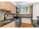 Modern kitchen featuring stainless steel appliances and tile backsplash at 2533 E 11Th Ave # 1, Denver, CO 80206