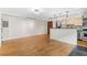 Bright living room features hardwood floors, modern track lighting, and an open layout adjacent to the kitchen at 2533 E 11Th Ave # 1, Denver, CO 80206