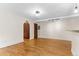 Bright living room with hardwood floors and an arched doorway at 2533 E 11Th Ave # 1, Denver, CO 80206