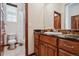 Bathroom with a shower/tub combo and granite countertop at 5723 S Union Ct, Littleton, CO 80127