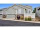 Exterior view of house, with garage and landscaping at 5723 S Union Ct, Littleton, CO 80127