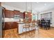 Modern kitchen featuring wood cabinets, an island, and stainless steel appliances at 5723 S Union Ct, Littleton, CO 80127