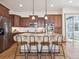 Modern kitchen boasts stainless steel appliances, an island with seating, and ample cabinet space at 5723 S Union Ct, Littleton, CO 80127