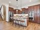 Modern kitchen boasting stainless steel appliances, an island with seating, and ample cabinet space at 5723 S Union Ct, Littleton, CO 80127