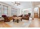 Relaxing living room featuring hardwood floors and a cozy fireplace at 5723 S Union Ct, Littleton, CO 80127