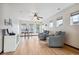 Open living area with wood floors, ceiling fan, and lots of natural light at 5723 S Union Ct, Littleton, CO 80127