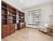 Office area showcases custom built-ins, wood floors and great natural light at 5723 S Union Ct, Littleton, CO 80127