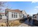 Inviting two-story home featuring multiple windows, manicured landscaping, and an accessible sidewalk at 9796 W Hinsdale Pl # 4, Littleton, CO 80128