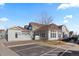 View of a modern home showing the back exterior with a parking space and connecting walkways at 9796 W Hinsdale Pl # 4, Littleton, CO 80128