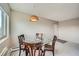Cozy dining area with glass-top table and stylish lighting fixture at 1045 N Pennsylvania St # 601, Denver, CO 80203