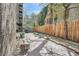 Private patio area with stone benches and mature trees at 1045 N Pennsylvania St # 601, Denver, CO 80203