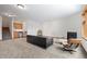 Large basement living area with fireplace, wet bar and neutral decor at 27711 Moffat Rd, Evergreen, CO 80439