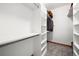 A large walk-in closet with ample shelving and room for storage at 27711 Moffat Rd, Evergreen, CO 80439