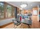 Dining space with large window offering wooded views, perfect for Gathering meals at 27711 Moffat Rd, Evergreen, CO 80439