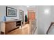 Entry hallway boasting hardwood floors, fresh paint, and natural light at 27711 Moffat Rd, Evergreen, CO 80439