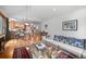 Bright, open living area flowing into the dining and kitchen area at 27711 Moffat Rd, Evergreen, CO 80439